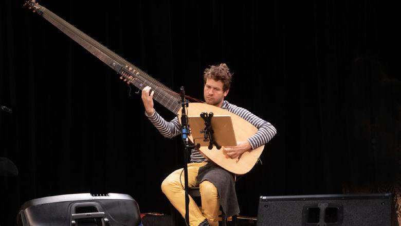 A member of the Chivalrous Crickets plays an instrument at Penn State Abington